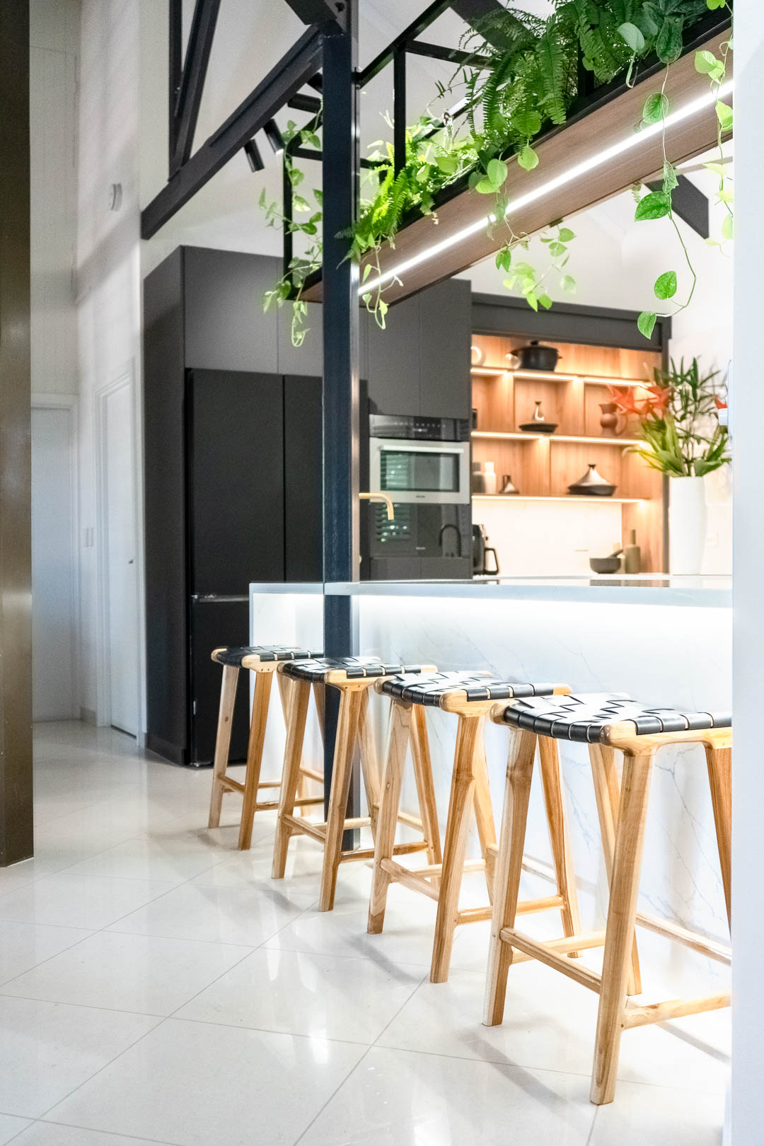 Brinkin kitchen with tambour door and cabinet lighting by JM Interior Design